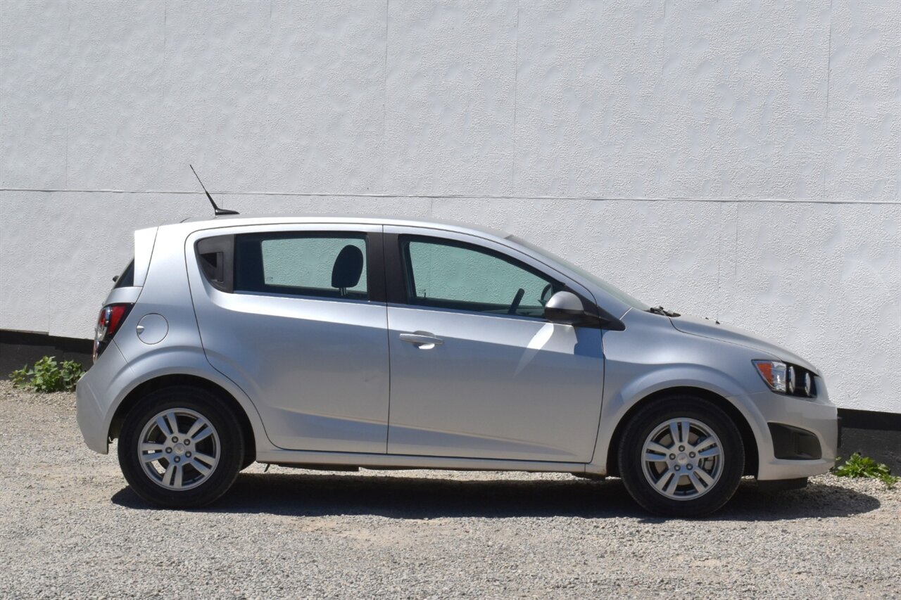 2012 Chevrolet Sonic LT 4dr Hatchback! 27 City MPG! 37 Hwy MPG! CD/Aux-In! Bluetooth Connectivity! Air Conditioning! Compact & Easy to Park! Front-Wheel Drive! Stability Control! Traction Control! Rear Child Safety Locks! - Photo 6 - Portland, OR 97266
