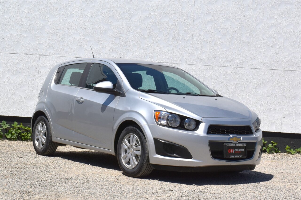 2012 Chevrolet Sonic LT  4dr Hatchback! 27 City MPG! 37 Hwy MPG! CD/Aux-In! Bluetooth Connectivity! Air Conditioning! Compact & Easy to Park! Front-Wheel Drive! Stability Control! Traction Control! Rear Child Safety Locks! - Photo 1 - Portland, OR 97266