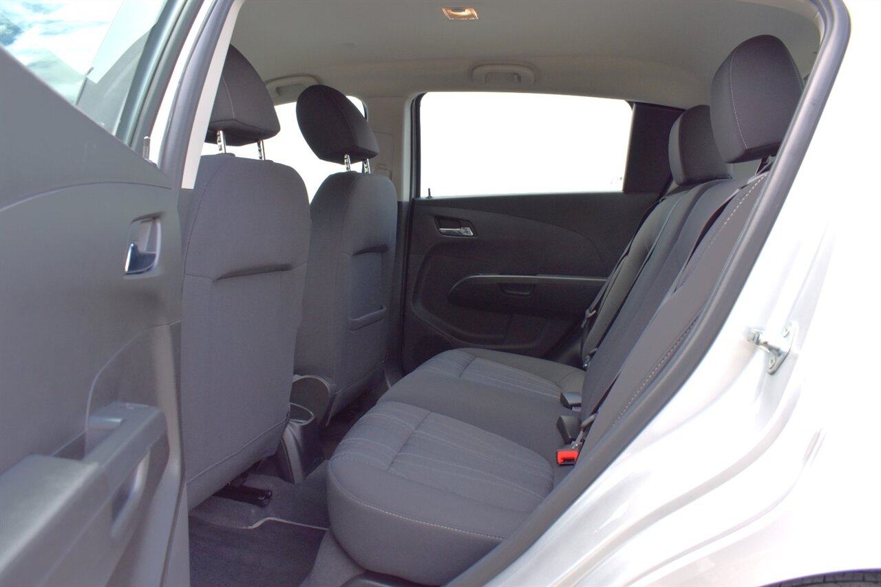 2012 Chevrolet Sonic LT 4dr Hatchback! 27 City MPG! 37 Hwy MPG! CD/Aux-In! Bluetooth Connectivity! Air Conditioning! Compact & Easy to Park! Front-Wheel Drive! Stability Control! Traction Control! Rear Child Safety Locks! - Photo 22 - Portland, OR 97266