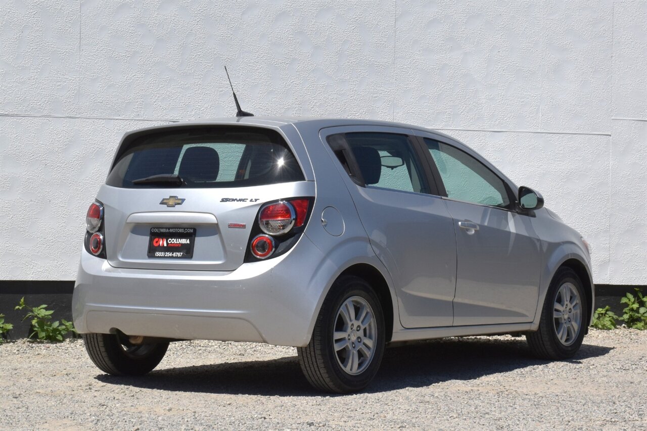 2012 Chevrolet Sonic LT 4dr Hatchback! 27 City MPG! 37 Hwy MPG! CD/Aux-In! Bluetooth Connectivity! Air Conditioning! Compact & Easy to Park! Front-Wheel Drive! Stability Control! Traction Control! Rear Child Safety Locks! - Photo 5 - Portland, OR 97266