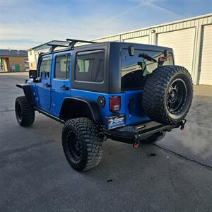2015 Jeep Wrangler Unlimited Freedom Edition   - Photo 4 - West Haven, UT 84401