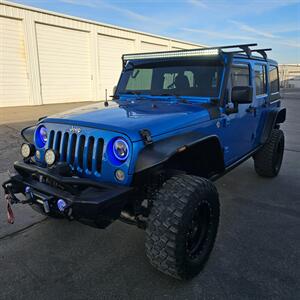 2015 Jeep Wrangler Unlimited Freedom Edition   - Photo 2 - West Haven, UT 84401