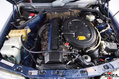 1990 Mercedes-Benz 2.6   - Photo 140 - Houston, TX 77024