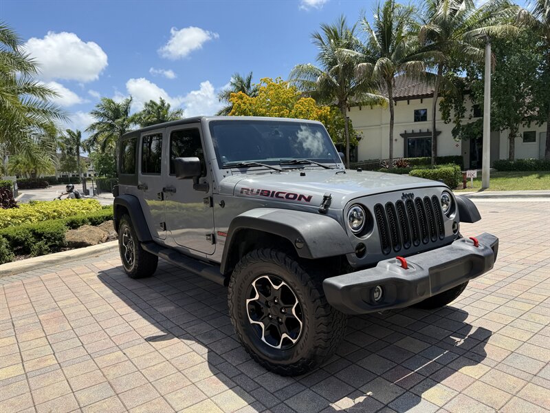 2014 Jeep Wrangler Unlimited Sport  WOW !! JEEP WRANGLER SPORT !! ONLY 122K !!! BRAND NEW WRAP !! CALL TODAY 954-902-9298 MATT - Photo 1 - Pompano Beach, FL 33069